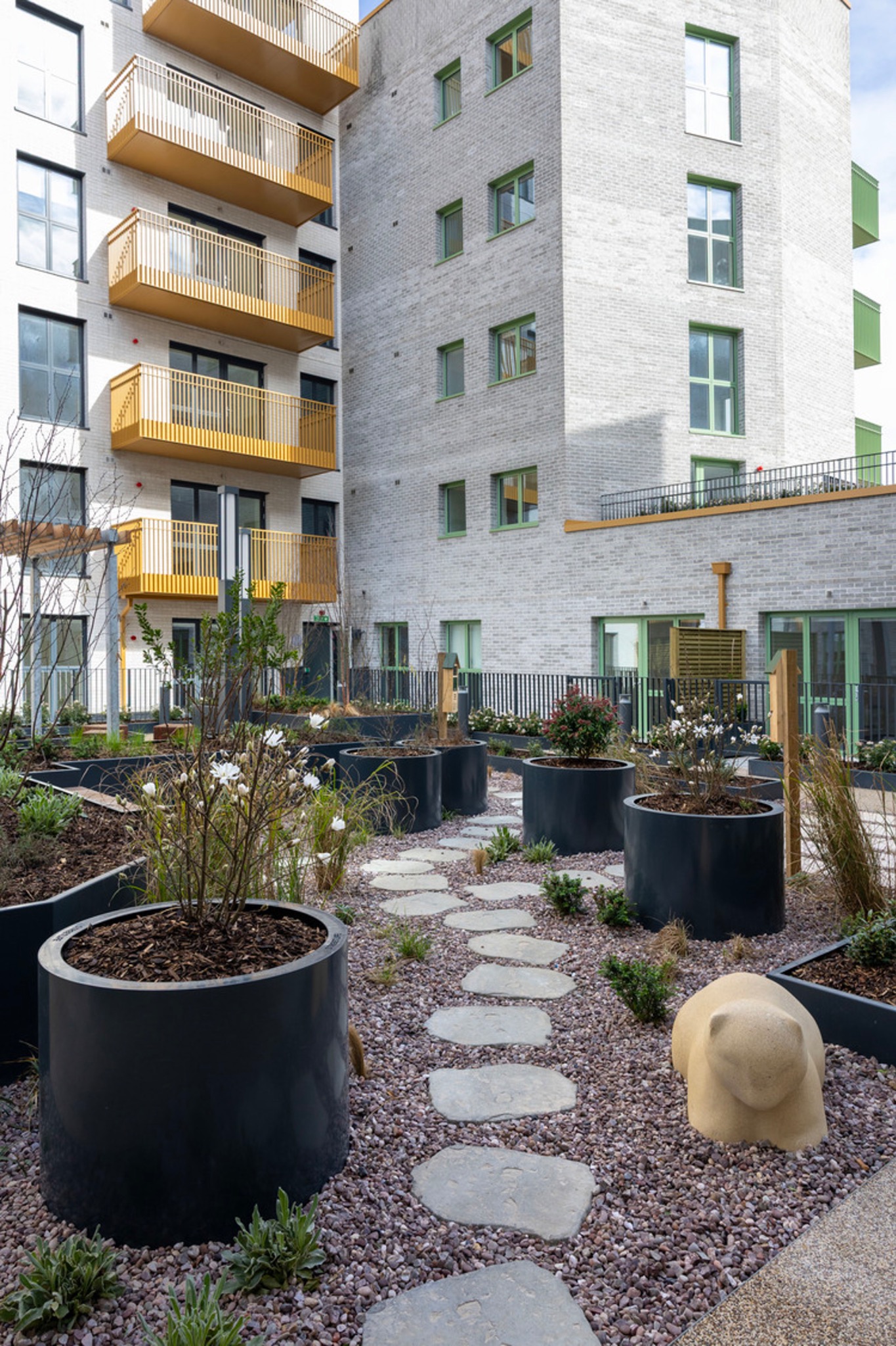 Landscaped courtyard and new homes at Hayes Estate