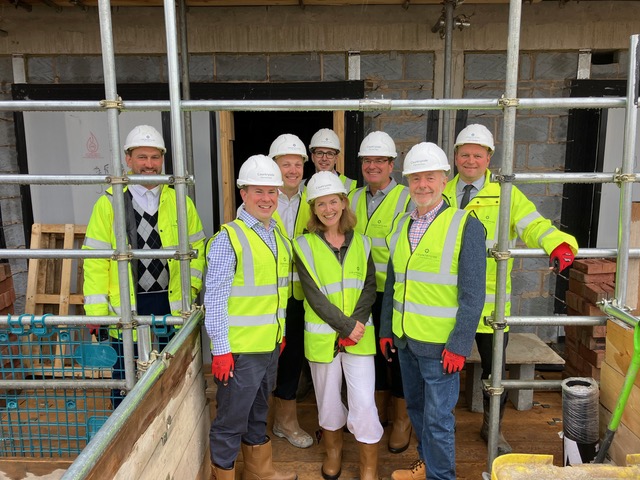 Catherine Cummings with a project team on a construction site